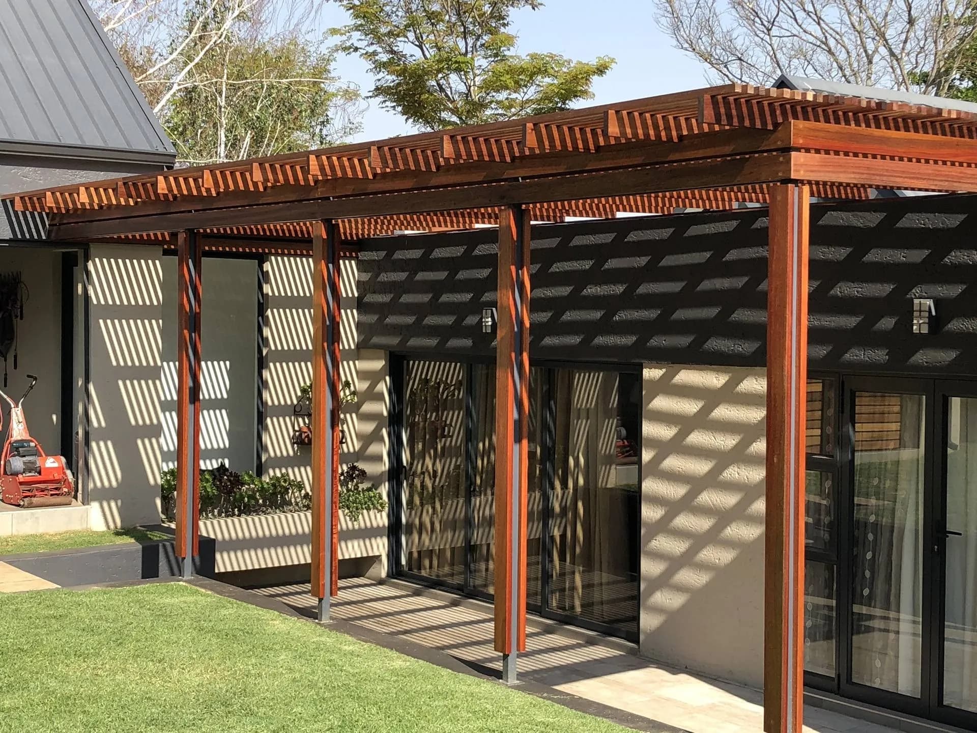 Completed timber pergola over a patio, built by Turfex in Centurion